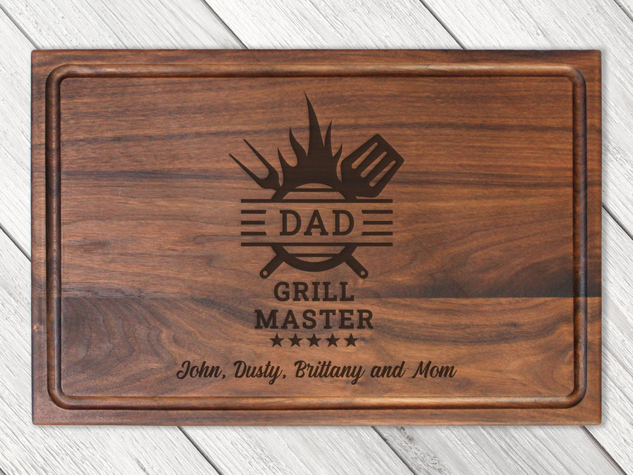 Walnut cutting board engraved with a Dad Grill Master design
