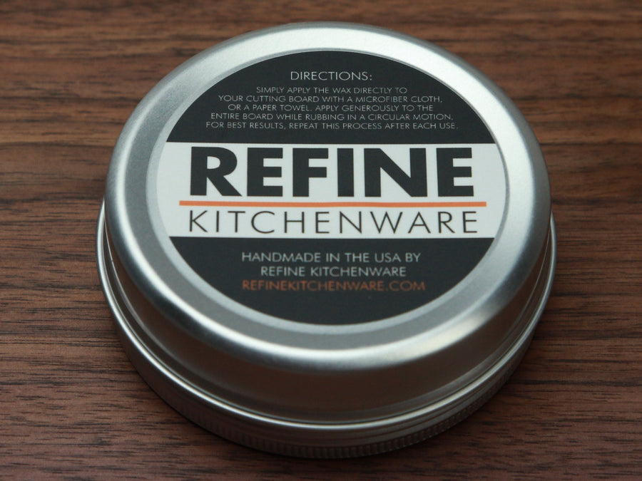 Close view of the labeled Refine Kitchenware cutting board wax tin