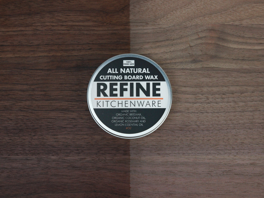 Cutting board wax tin placed on a wooden board