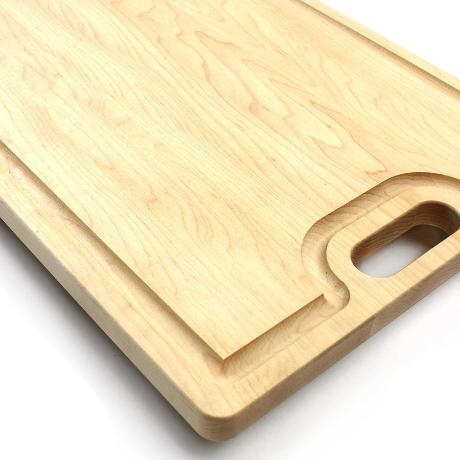 Close view of a maple board's rounded cutout handle