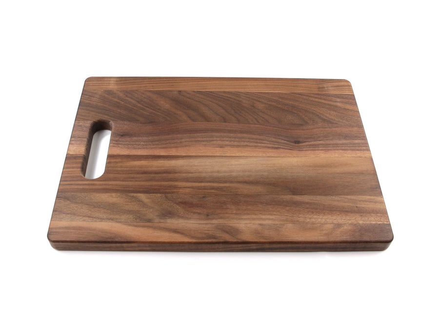 Compact walnut cutting board with a single cutout handle