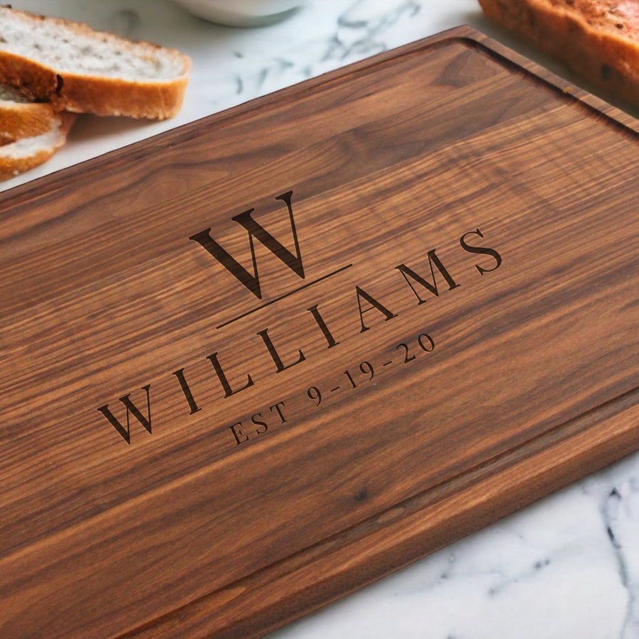 Walnut board engraved with an example initial, surname and established date