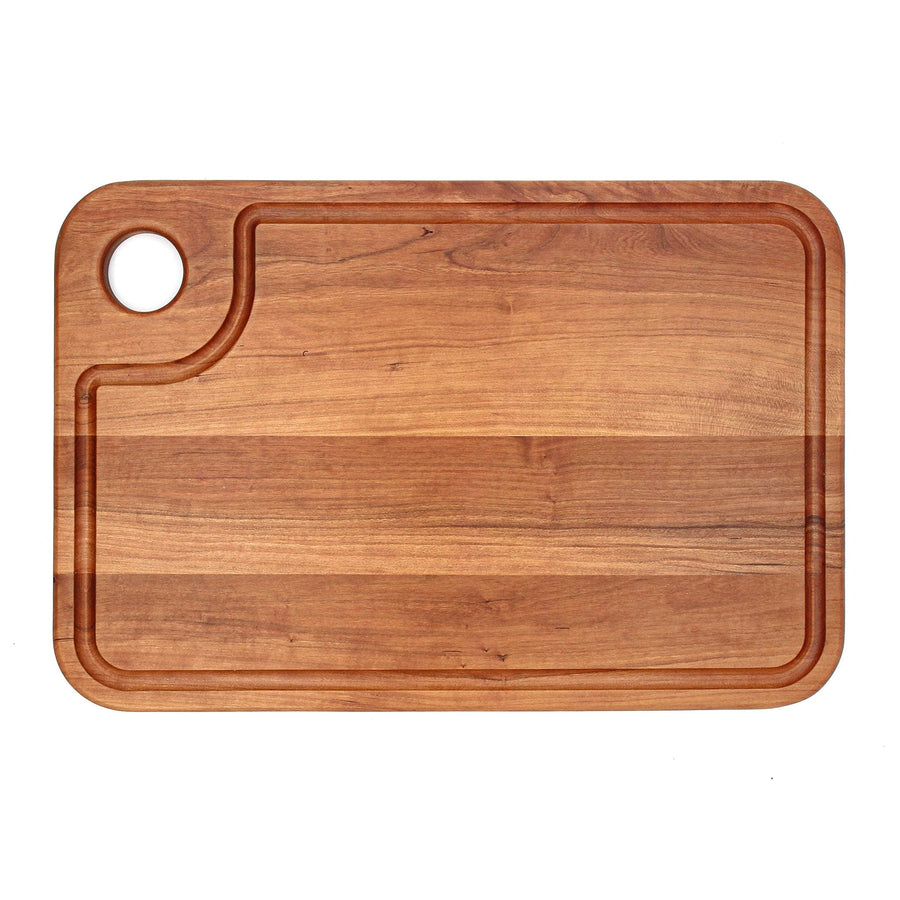 Cherry thumb-hole cutting board with a shaped perimeter groove