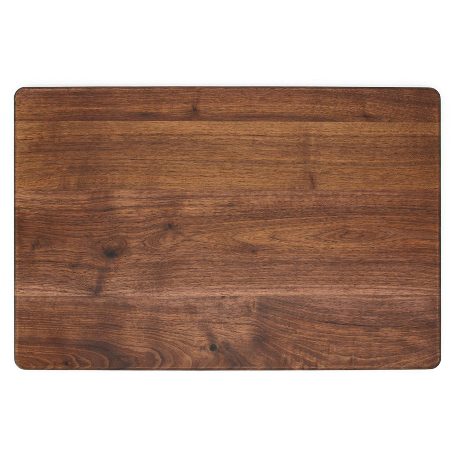 Plain reverse surface of a rectangular walnut cutting board