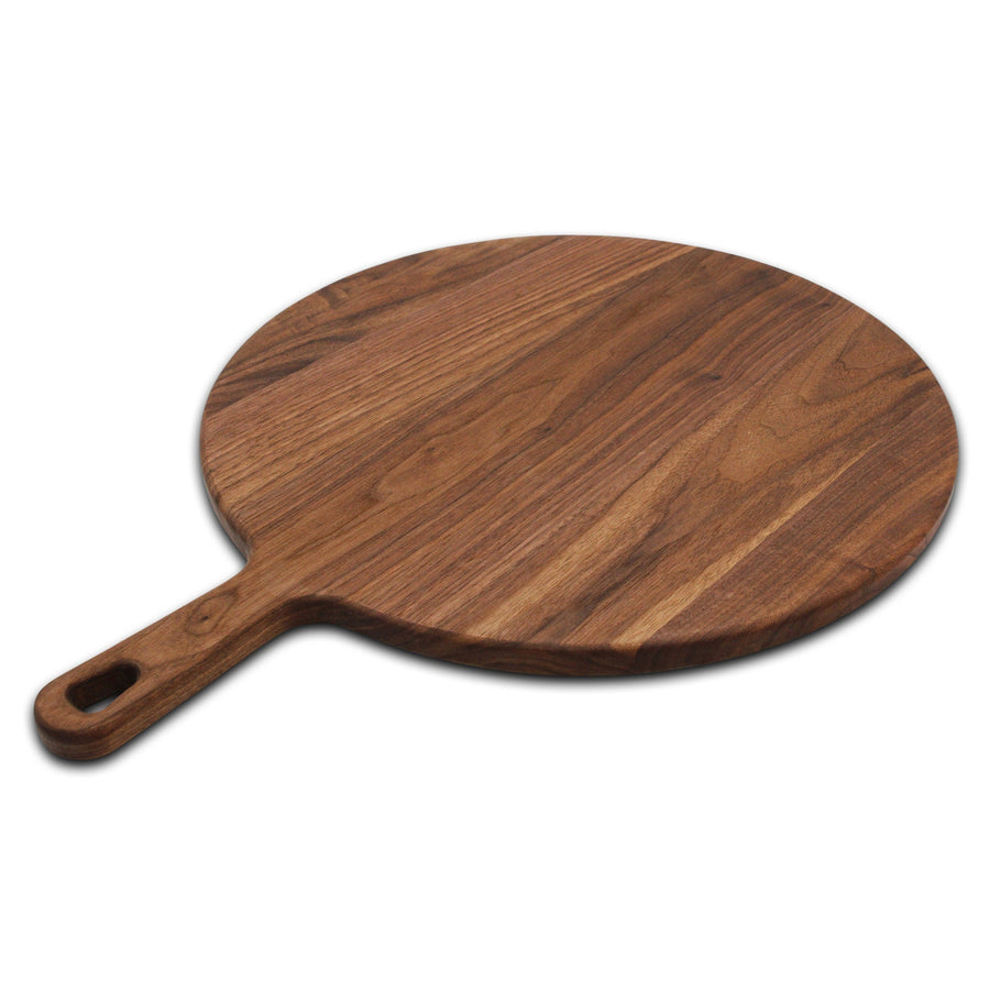 Round walnut paddle board shown at an angle on a white background