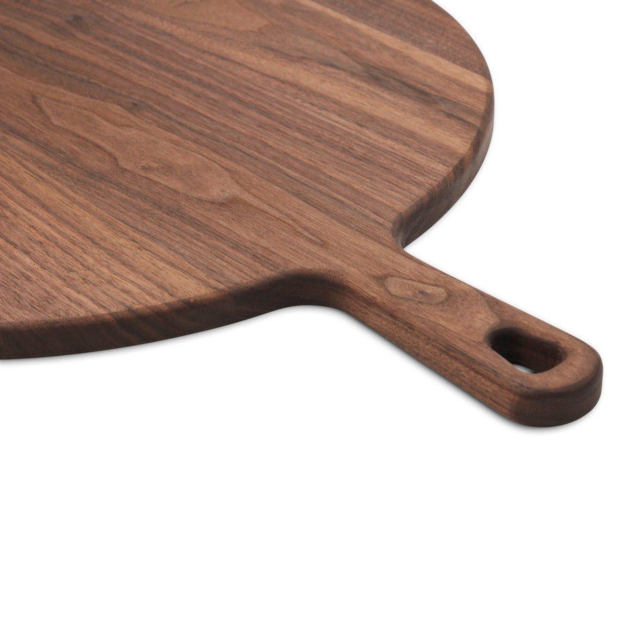 Close view of a walnut paddle handle and hanging hole