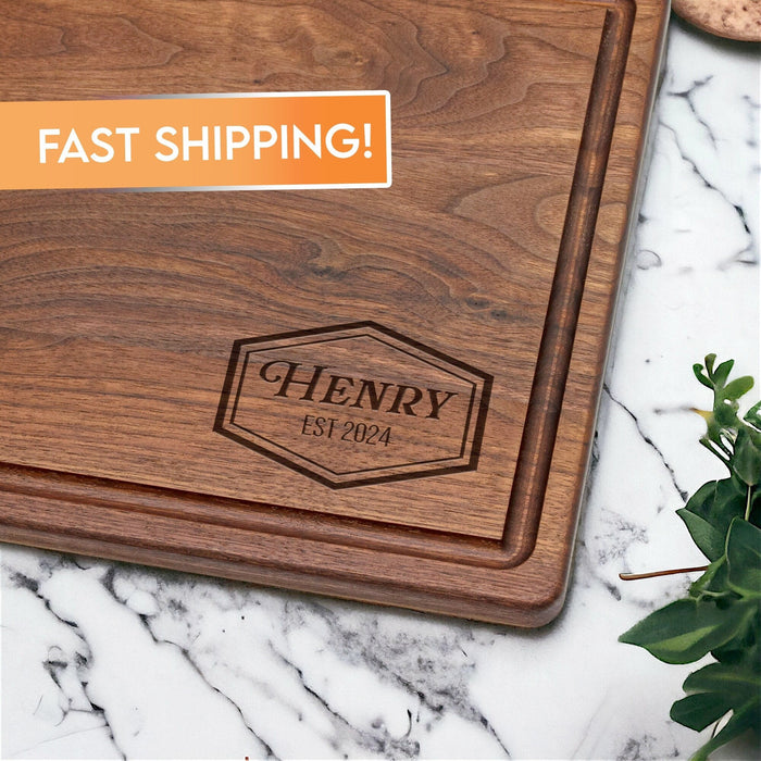 Walnut cutting board engraved with an example family-name shield design