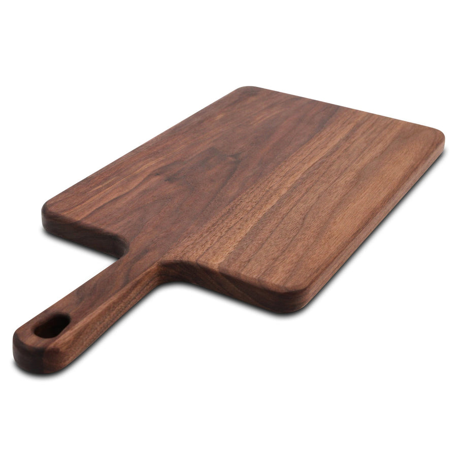 Walnut paddle serving board showing its long surface and shaped handle