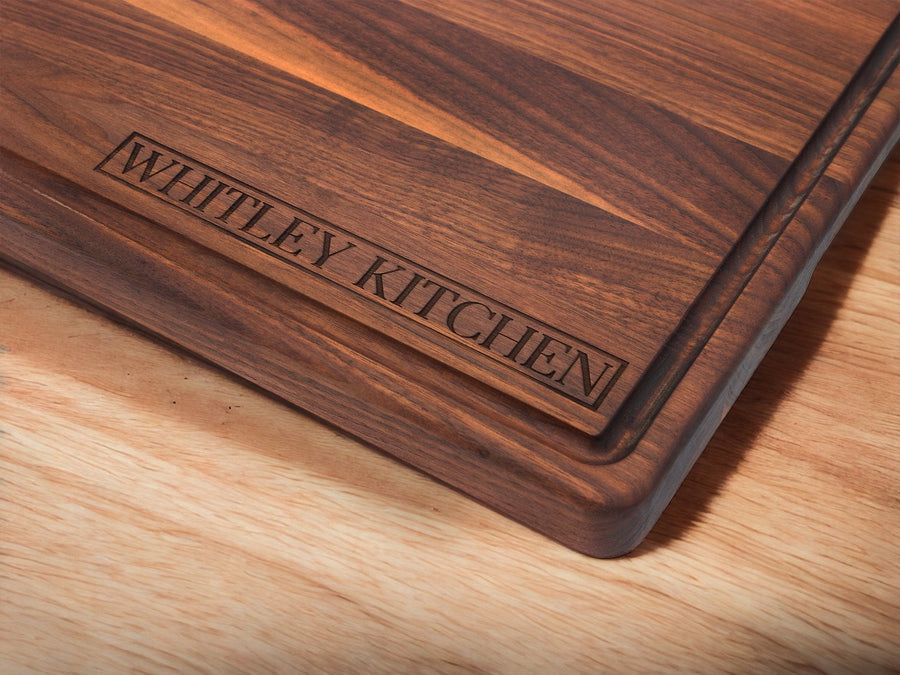Walnut cutting board engraved with a sample kitchen name