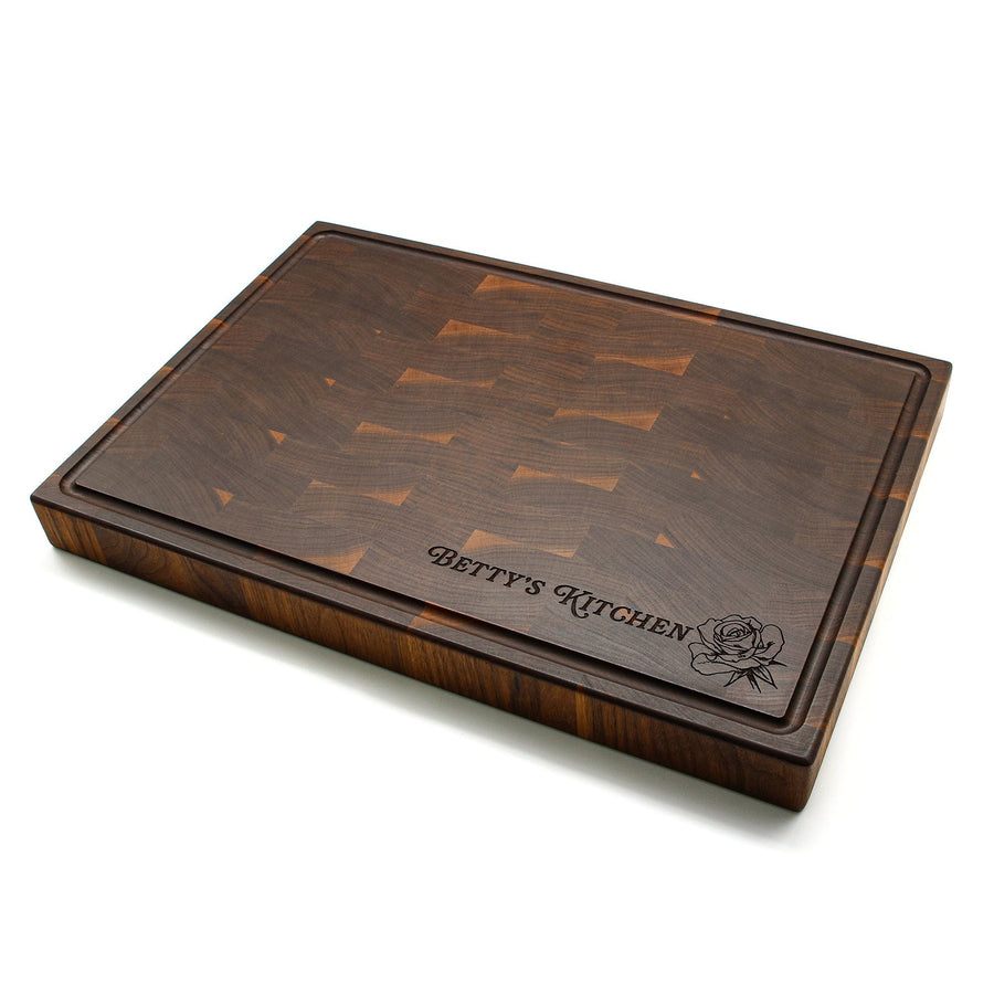 Walnut end-grain butcher block with a personalized kitchen-name engraving