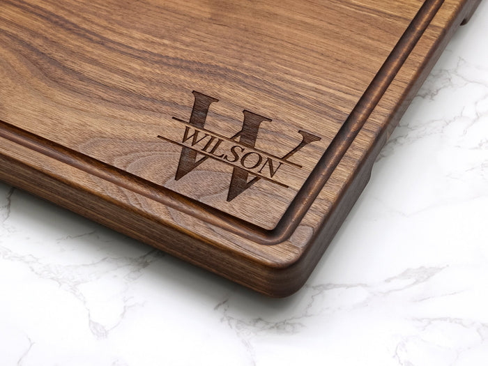 Walnut board corner engraved with a family initial and name