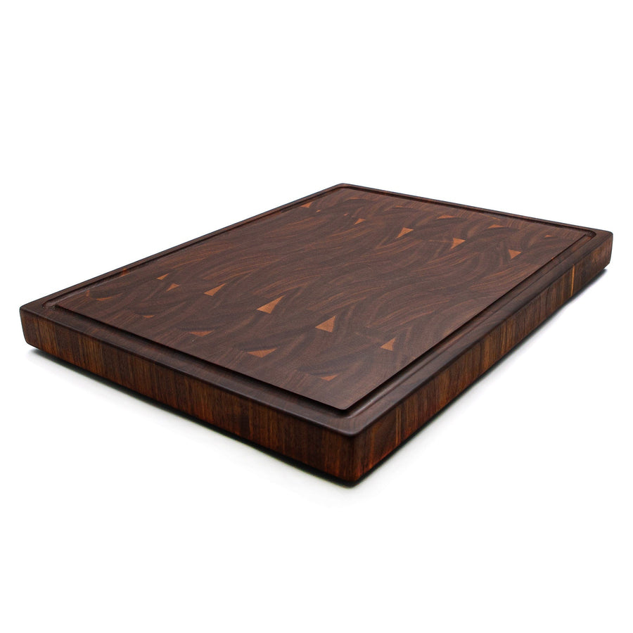 Walnut end-grain butcher block photographed from a low angle