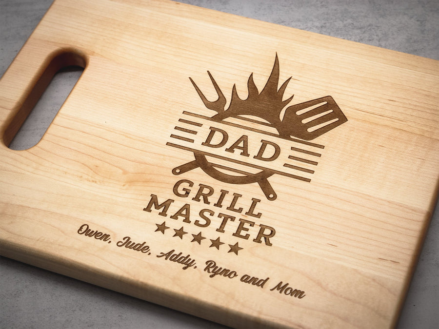 Maple board engraved with a Dad Grill Master design and example names
