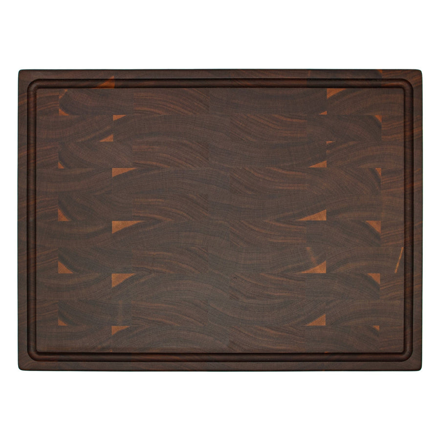 Overhead view of a walnut end-grain board with a perimeter groove