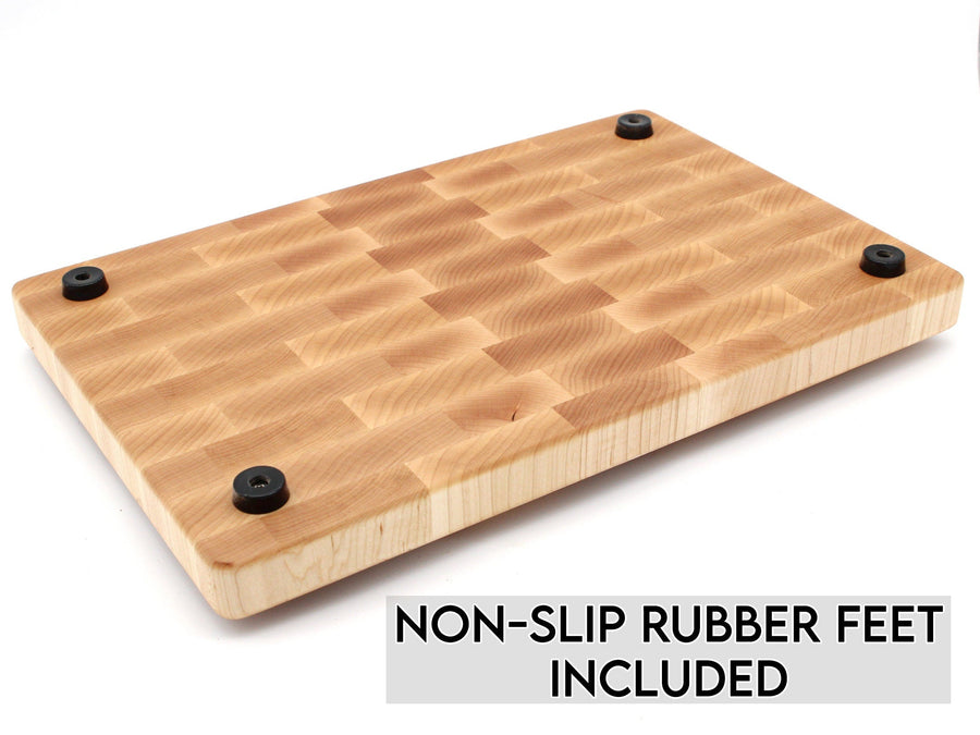 Underside of a maple end-grain board showing non-slip rubber feet