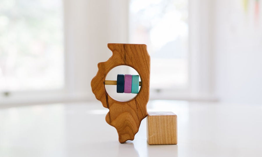 Illinois cherry wood rattle with an example of engraved personalization