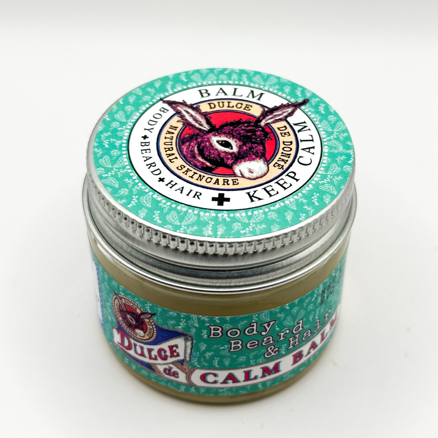 Angled view of Calm Balm in a green-labeled glass jar