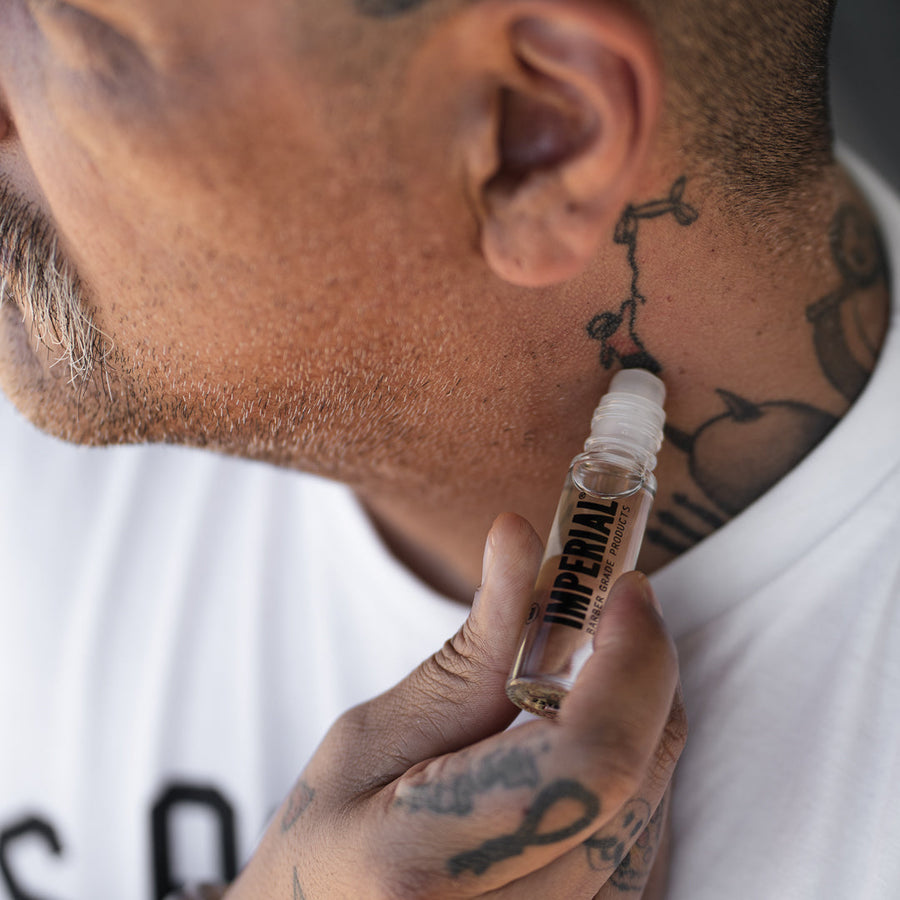 Crown One Roll-On Cologne — rollerball fragrance being applied to the neck