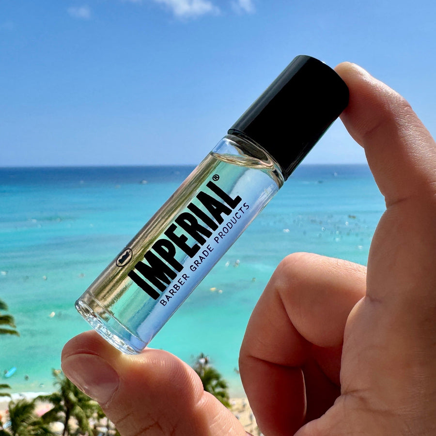 Crown One Roll-On Cologne — cologne bottle held outdoors near the water