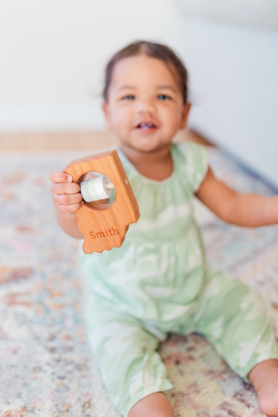 Indiana cherry wood rattle in a lifestyle setting
