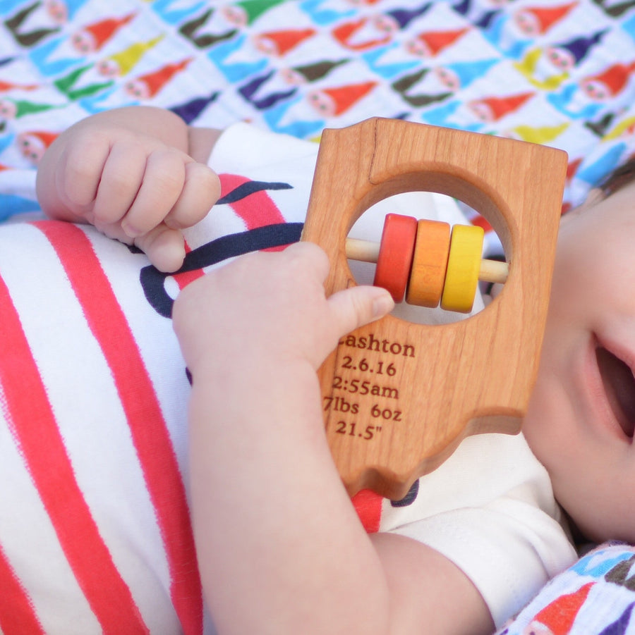 Indiana cherry wood rattle in a lifestyle setting