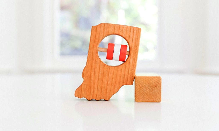 Indiana state-shaped cherry wood baby rattle with colored center disks