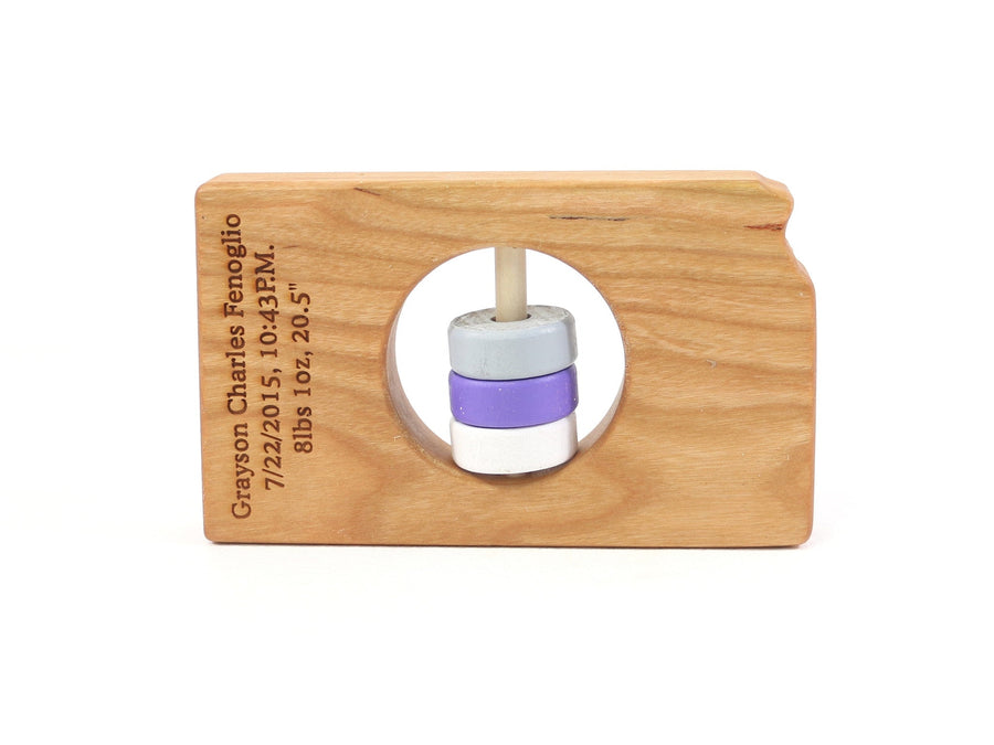 Kansas cherry wood rattle with an example of engraved personalization