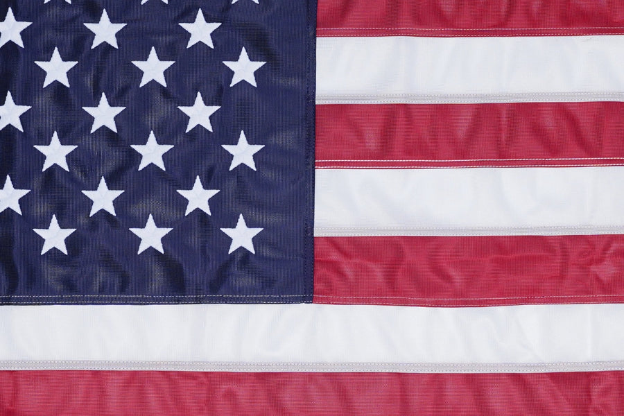 Close-up of embroidered stars and sewn stripes on Made in USA American flag