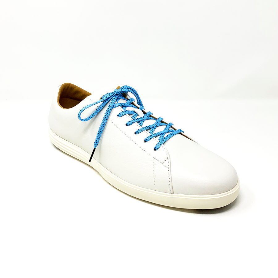 Light Blue & Black ticked flat shoelaces laced into a cream low-top sneaker