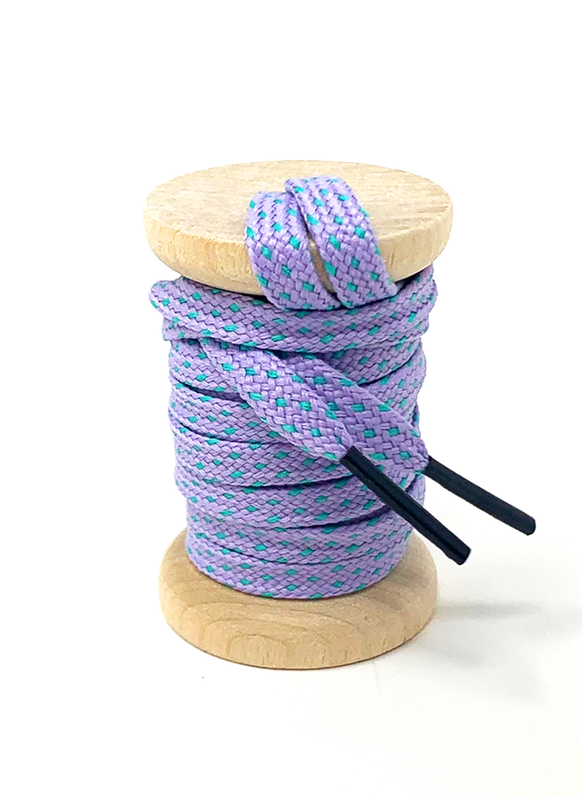 Lavender & Electric Green ticked flat shoelaces on a wooden spool