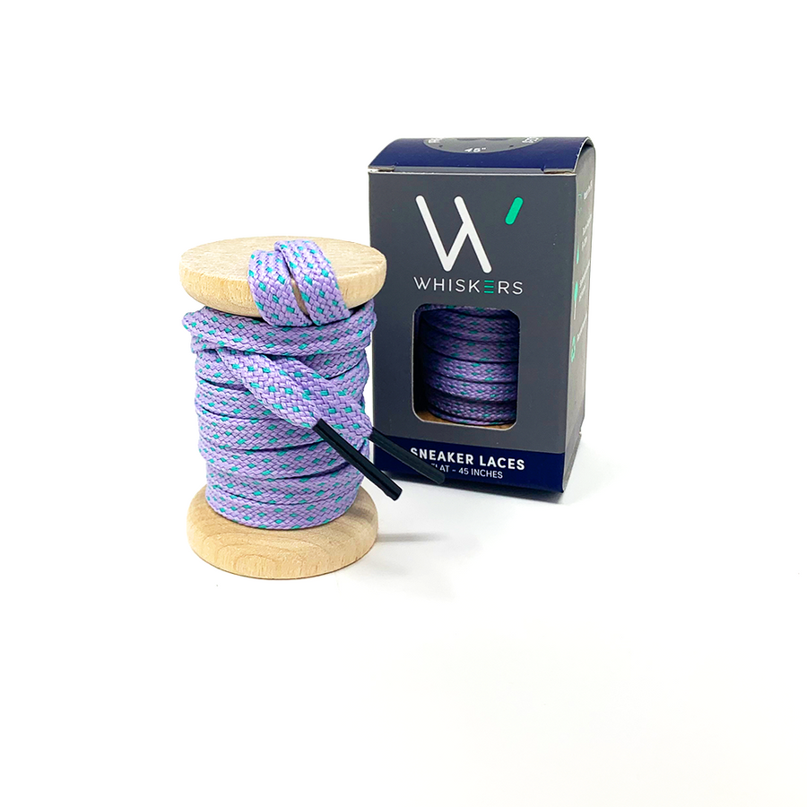 Lavender & Electric Green ticked flat shoelaces on a wooden spool beside the retail box