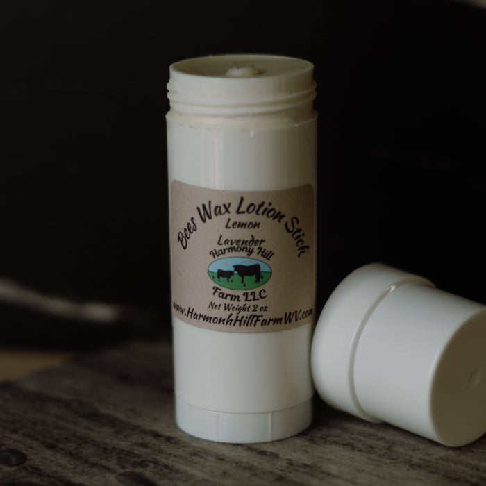 Lemon Lavender beeswax lotion stick in a 2 oz white tube with cap removed