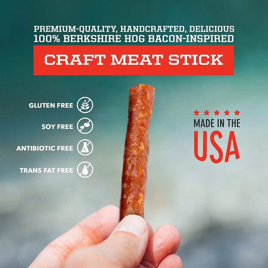 Hand holding a cut pork stick in a promotional graphic labeled made in USA