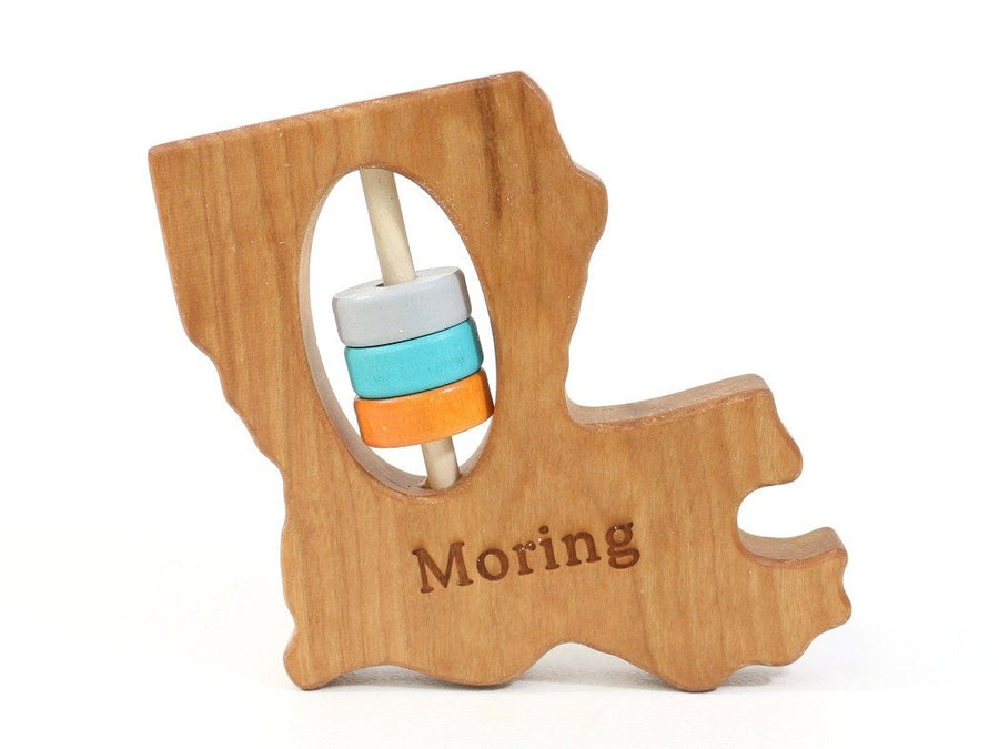 Louisiana cherry wood rattle with an example of engraved personalization
