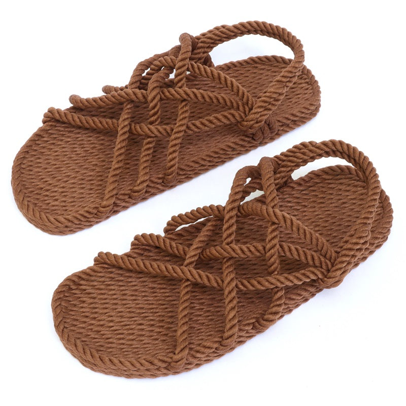 Pair of brown Utopian rope sandals on a white background