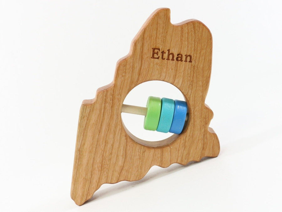 Maine cherry wood rattle with an example of engraved personalization