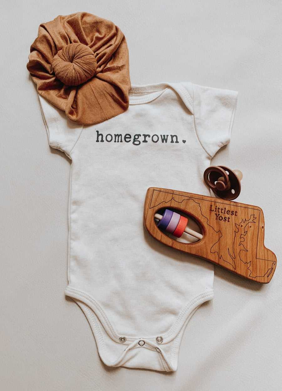 Maryland cherry wood rattle in a lifestyle setting