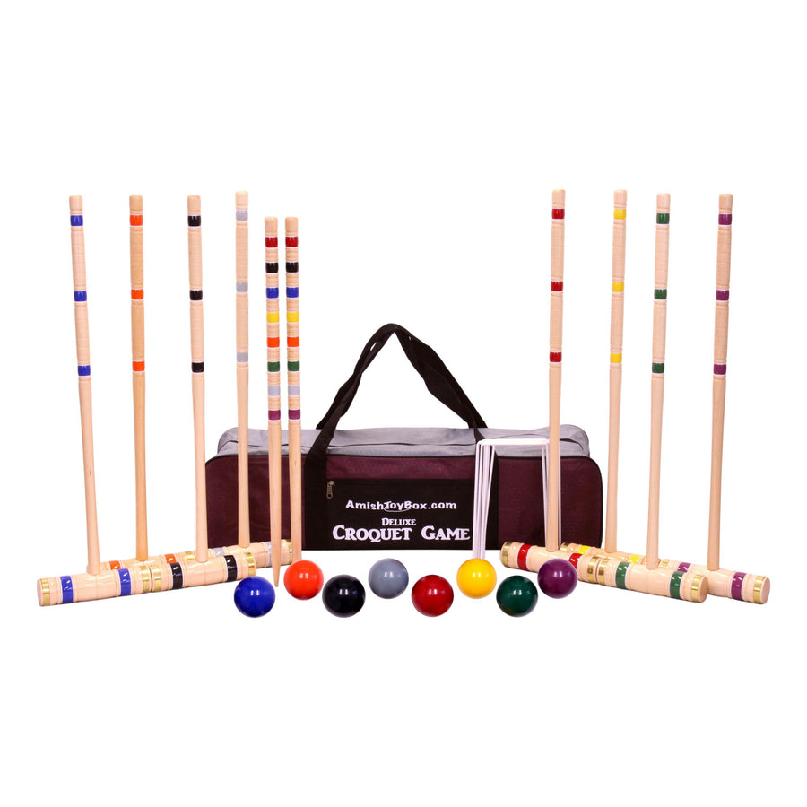 Croquet mallets and balls arranged with the set’s storage equipment