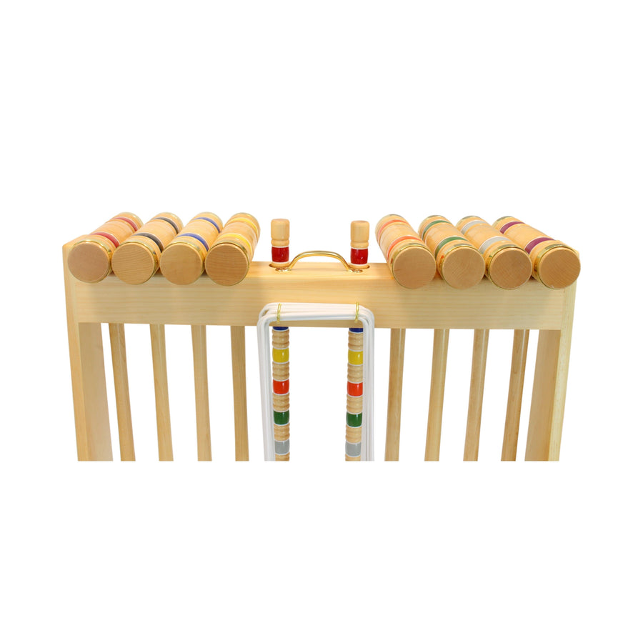 Croquet mallets and balls arranged with the set’s storage equipment