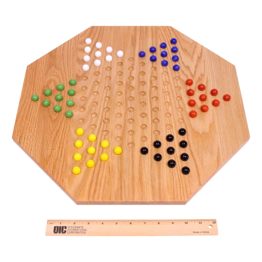 Chinese Checkers board beside a measuring tape
