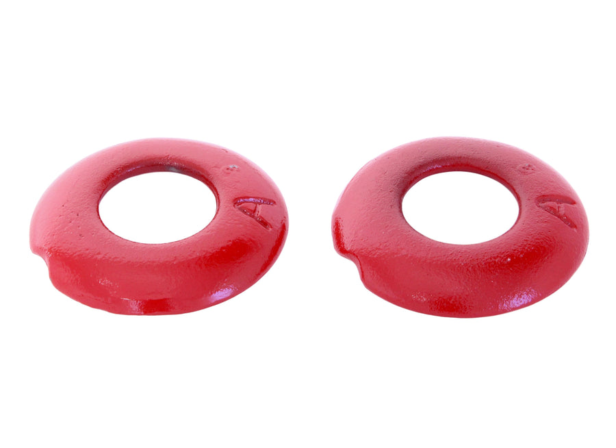 Two red cast-steel quoits shown close up