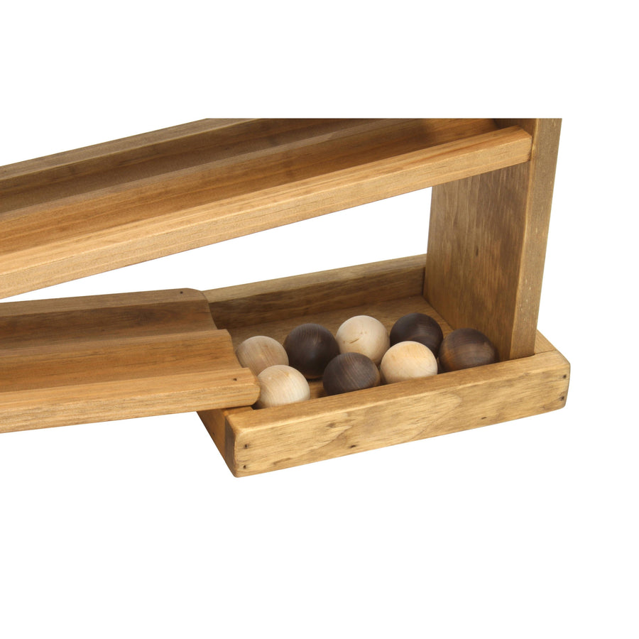 Wooden balls collected at the bottom of a ball roller