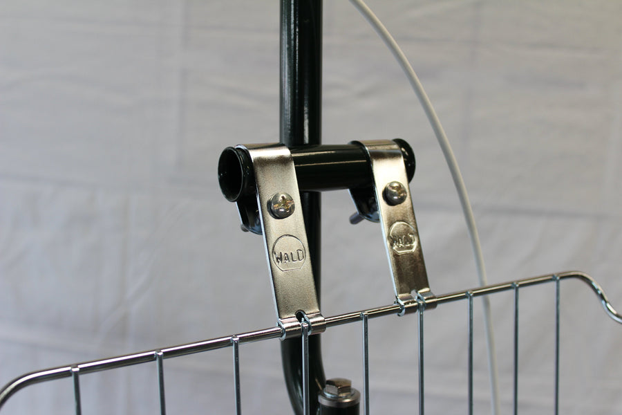 Kickstand mount and basket attachment detail on a scooter