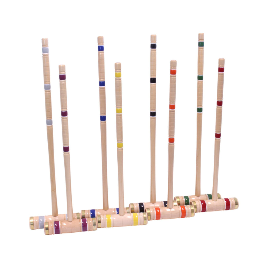 Croquet mallets and balls arranged with the set’s storage equipment