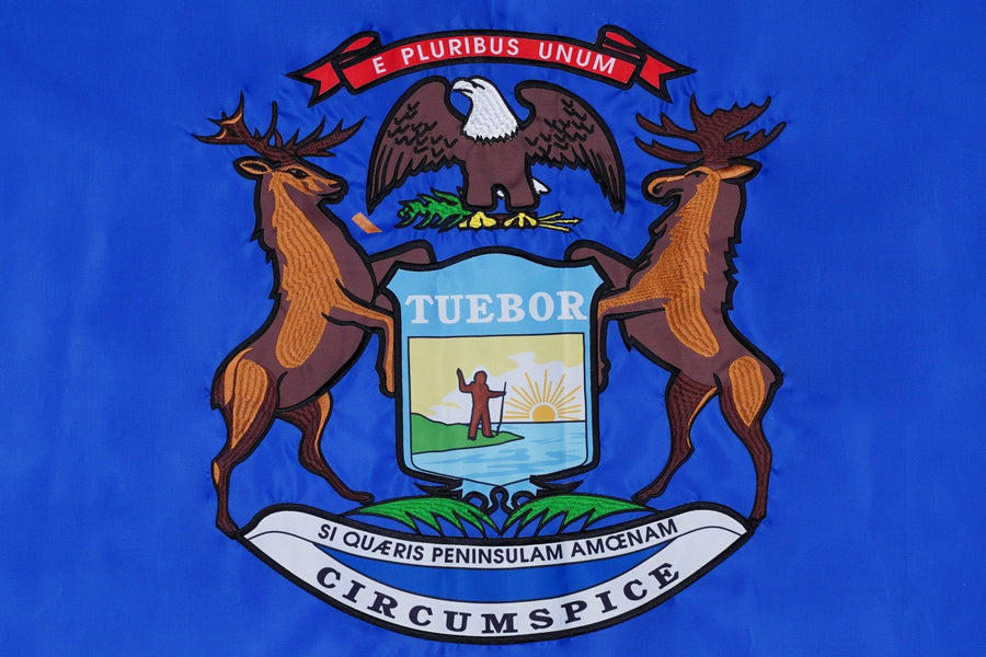Michigan state flag close-up with elk moose eagle and state shield