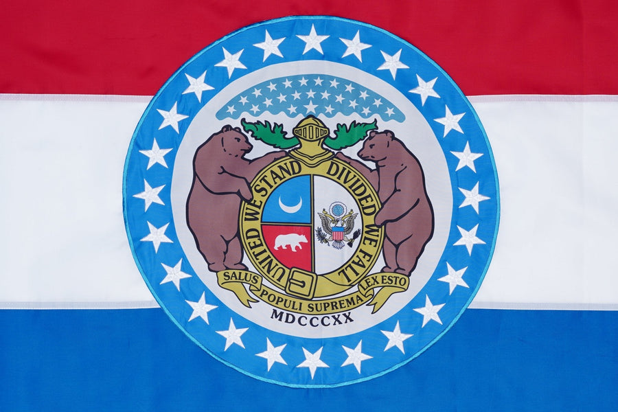 Missouri state flag close-up with red white blue stripes and state seal
