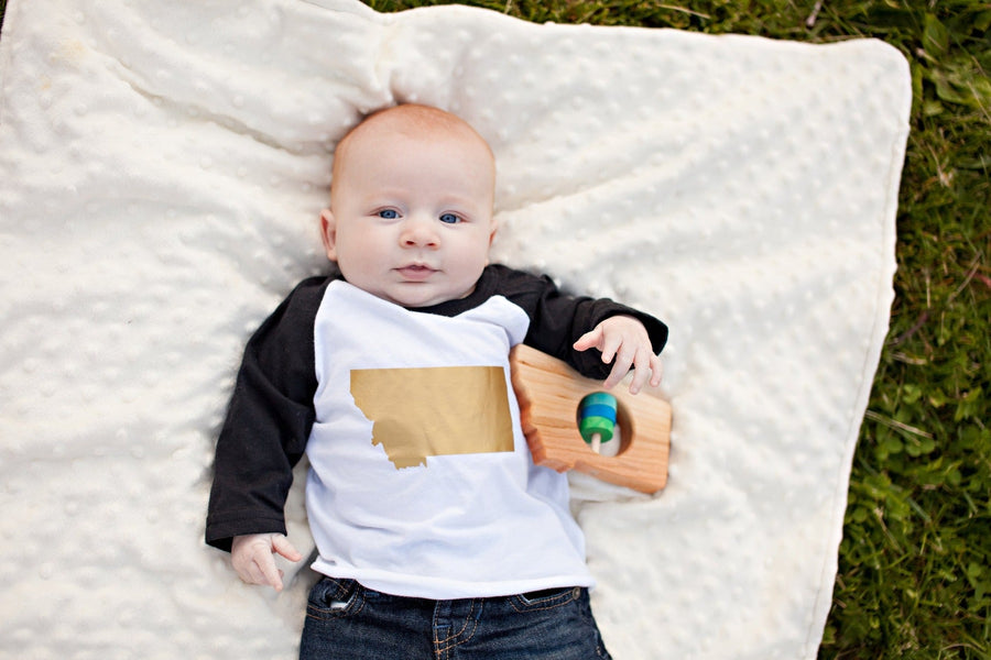Montana cherry wood rattle in a lifestyle setting