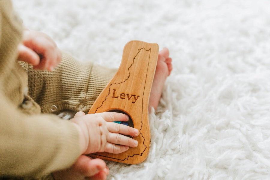 New Hampshire cherry wood rattle in a lifestyle setting