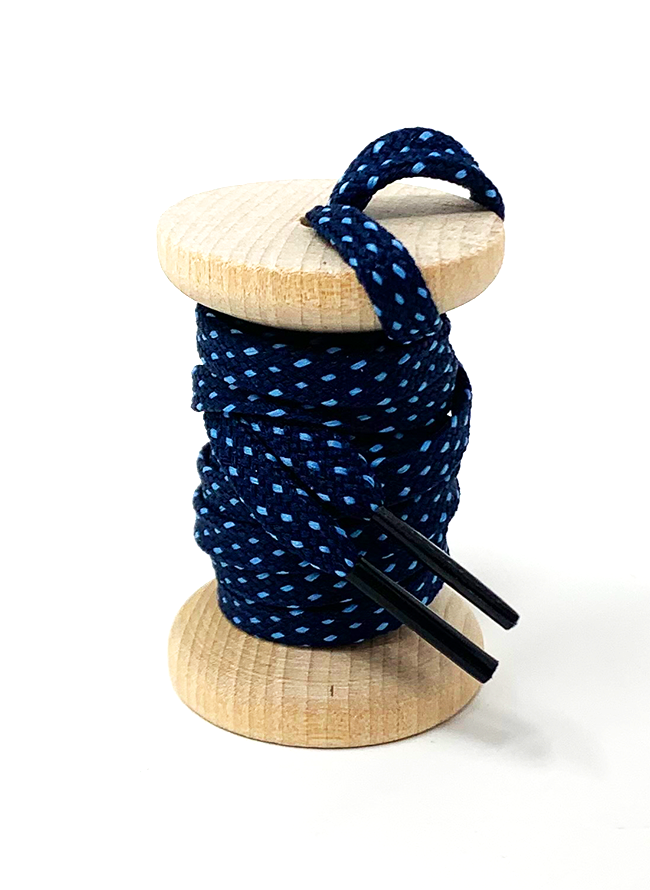 Navy & Light Blue ticked flat shoelaces on a wooden spool