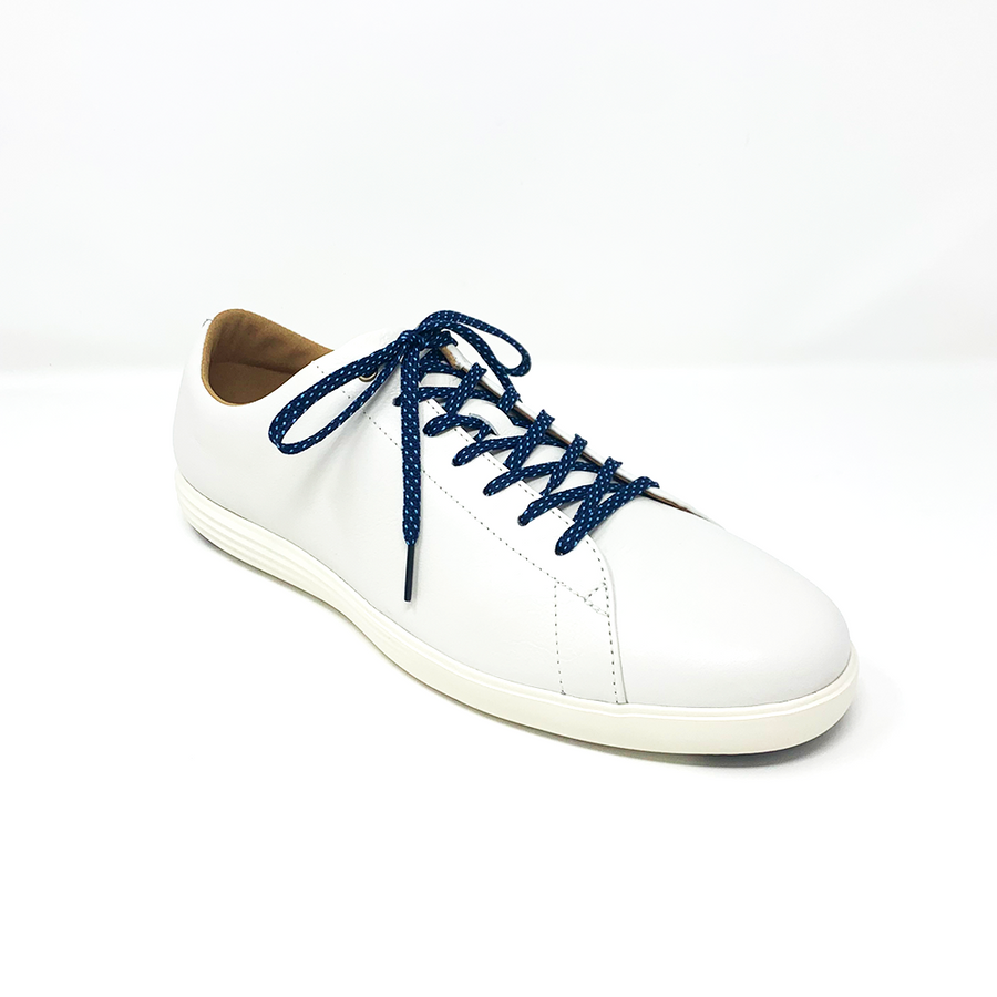 Navy & Light Blue ticked flat shoelaces laced into a cream low-top sneaker